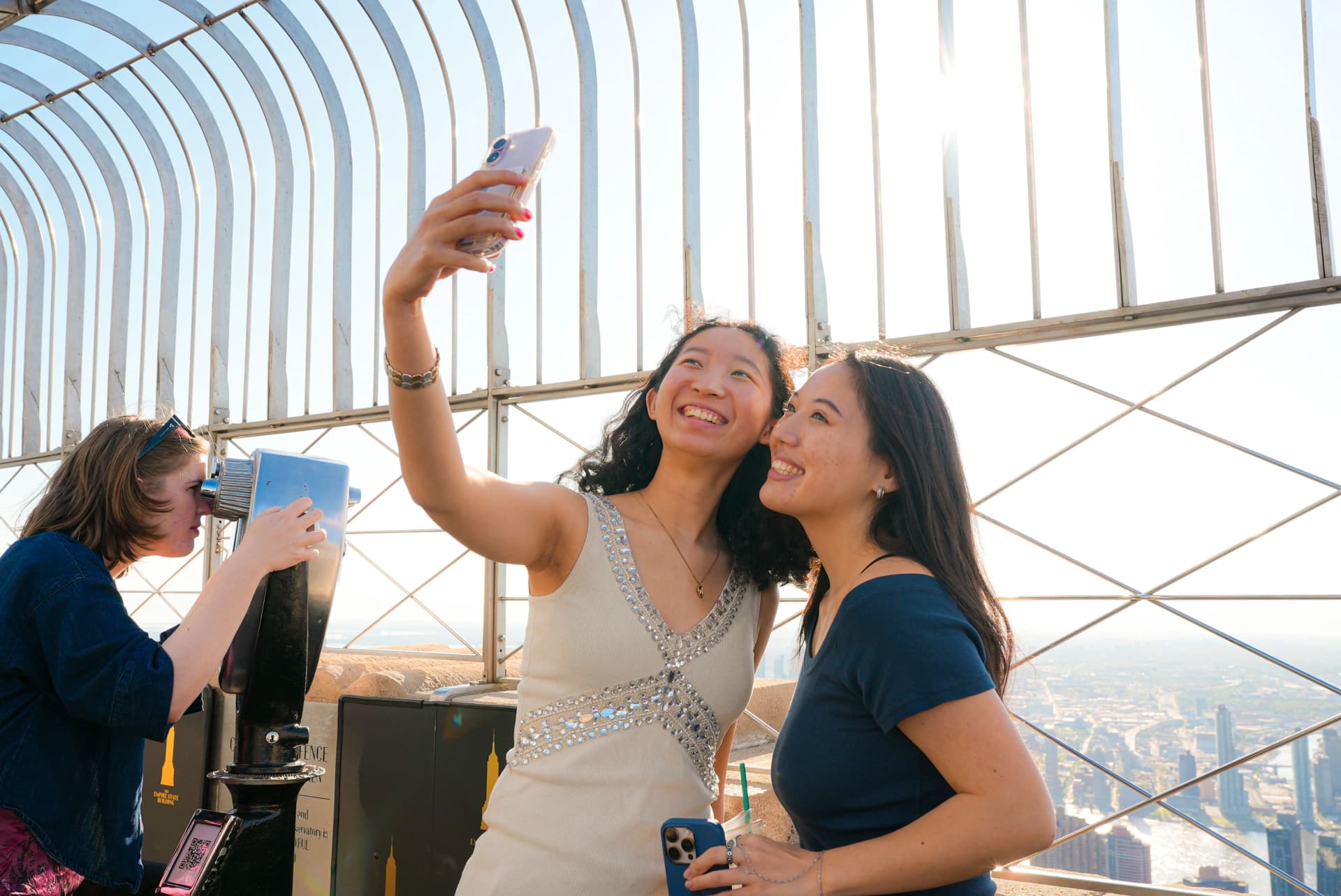 Girls taking selfies on the 86th Floor Observation Deck
