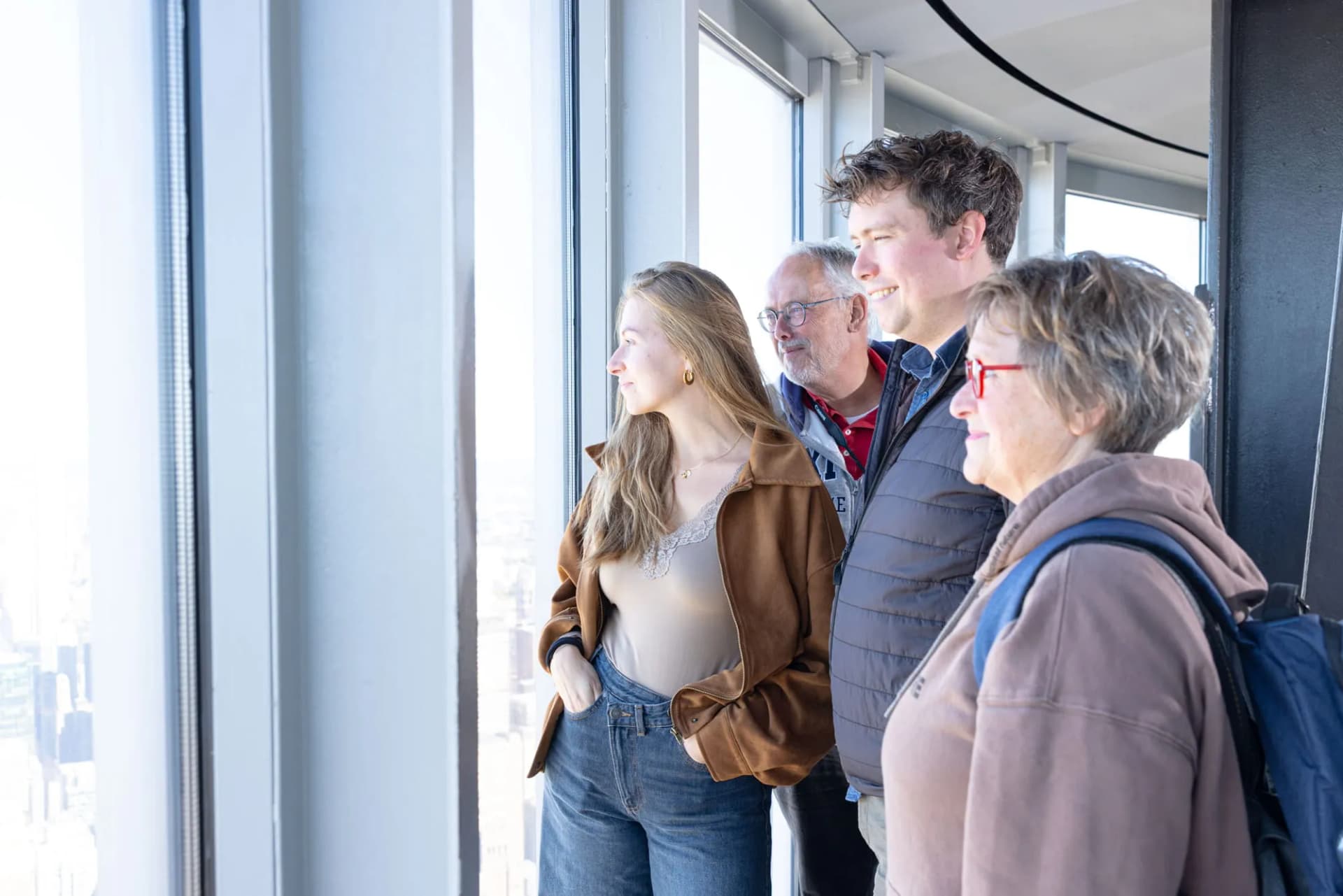 Family looking out to the Manhattan skyline at the 102nd Floor Observation Deck